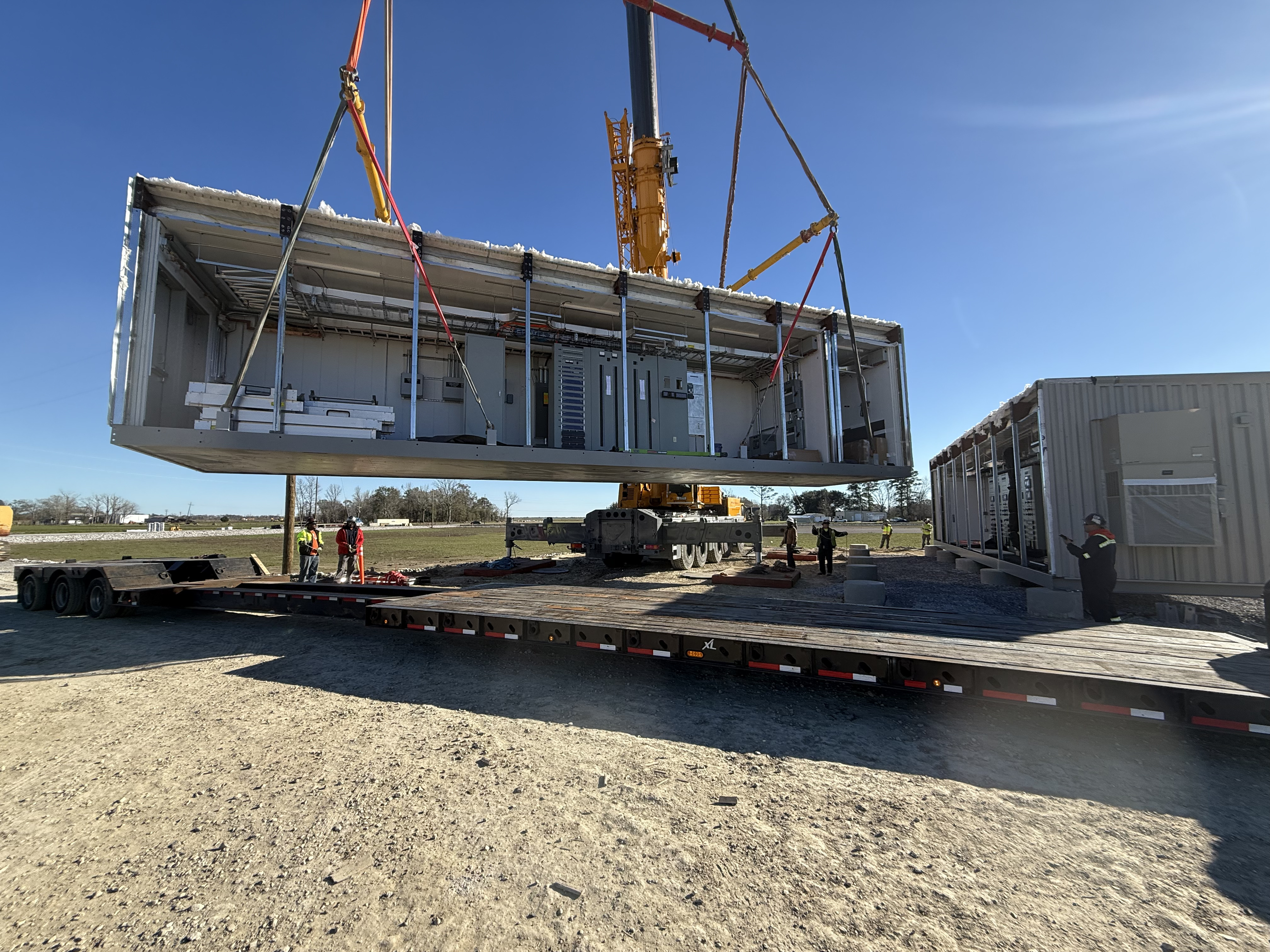 Precision Grid Services crew and control building on site